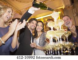 [Image: well-dressed-couple-pouring-champagne-st...-10992.jpg]