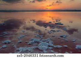 Sunset with lumps in the saltworks of Torrevieja, Costa Blanca, Alicante, Spain, Europe.