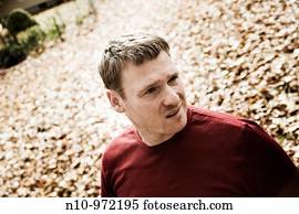 Young man in his backyard