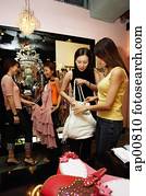 Women shopping in dress shop