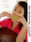 Girl eating bread Girl eating bread