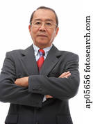 Businessman looking at camera, arms crossed