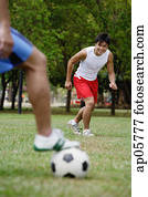 Two men playing soccer Two men playing soccer
