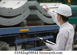 Man with hard helmet and clipboard Man with hard helmet and clipboard