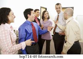 Group of co-workers talking in office