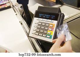 Person using debit card transaction machine