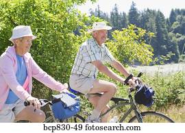 Couple riding their bicycles, Washington State, USA