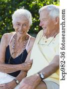 Portrait of a senior couple sitting outdoors