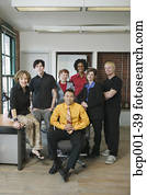 A group of seven young colleagues in an office.