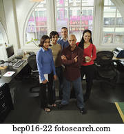 Five young business colleagues in their office.