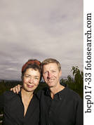 Portrait of a middleaged couple outdoors.