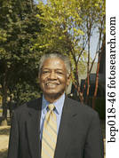 Portrait of a senior man wearing a suit.