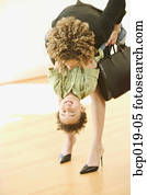 Woman shares a playful moment with her young son.