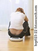A woman who is unhappy about her weight A woman who is unhappy about her weight