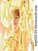 An attractive young woman holding measuring tapes