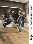 Four men in a band rock out