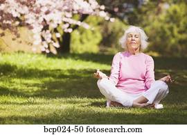 Senior woman in a yoga position