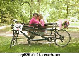 Newlyweds relax after a bicycle ride