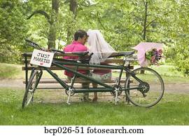 Newlyweds relax after a bicycle ride