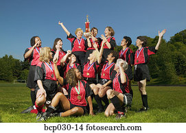 Female soccer team celebrating