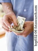 Man holding American currency