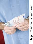 Man holding euro banknotes