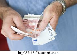 Man holding euro banknotes