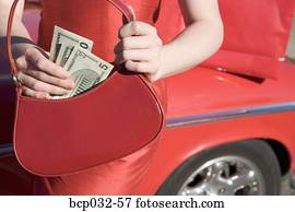 Woman holding American currency