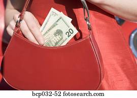 Woman holding American currency