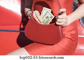 Woman holding American currency