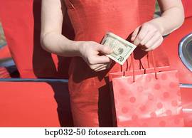 Woman holding American currency