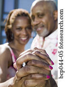 Couple showing off engagement ring