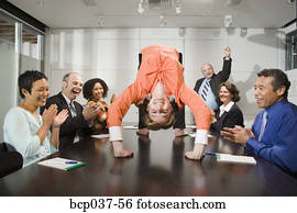 Businesswoman doing backbend at meeting Businesswoman doing backbend at meeting