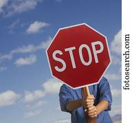 Man holding a stop signboard