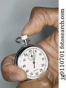 Human hand holding a stopwatch