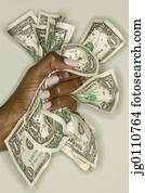 Woman's hand crushing bank notes