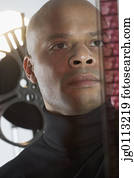 Mid adult man holding a film reel