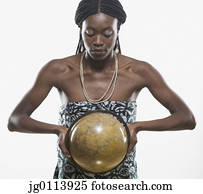 Close-up of a mid adult woman holding a globe