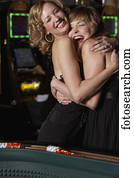 Women hugging at a casino