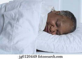 Senior woman asleep in bed