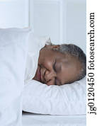 Senior woman asleep in bed