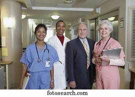 Businessman with hospital staff in hospital, Bethesda, Maryland, United States