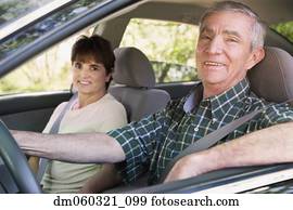 Senior Hispanic couple sitting in car