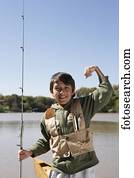 hispânico, menino, segurando, pesca pólo, ao ar livre