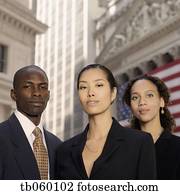 Portrait of businesspeople in front of American flag