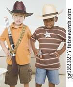 Two young boys dressed as cowboys