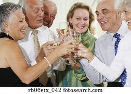 Senior couples toasting at party