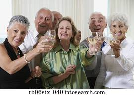 Senior couples toasting at party