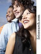 Low angle view of three young friends