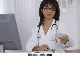 Female doctor handing over prescription